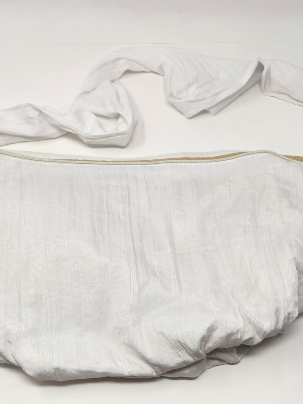 New white sling bag with white cloth handles